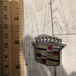 Cadillac Silver and Red Car Emblem